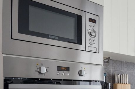 Stainless built-in microwave in a modern kitchen
